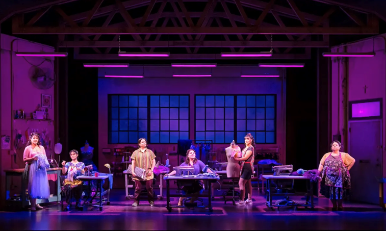 A group of people on a stage
Description automatically generated