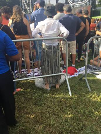 A picture containing grass, person, people, group
Description automatically generated